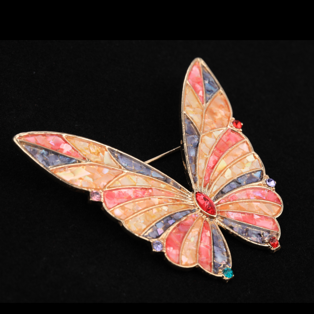 Close up of mother of pearl,nacre shell brooch＆Butterfly brooch on black