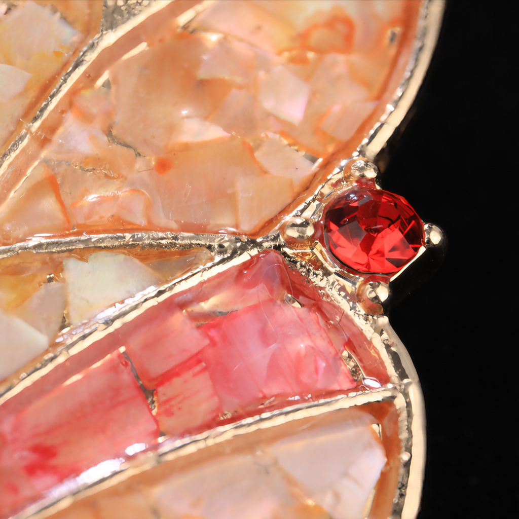 Close up of mother of pearl,nacre shell brooch＆Butterfly brooch on black