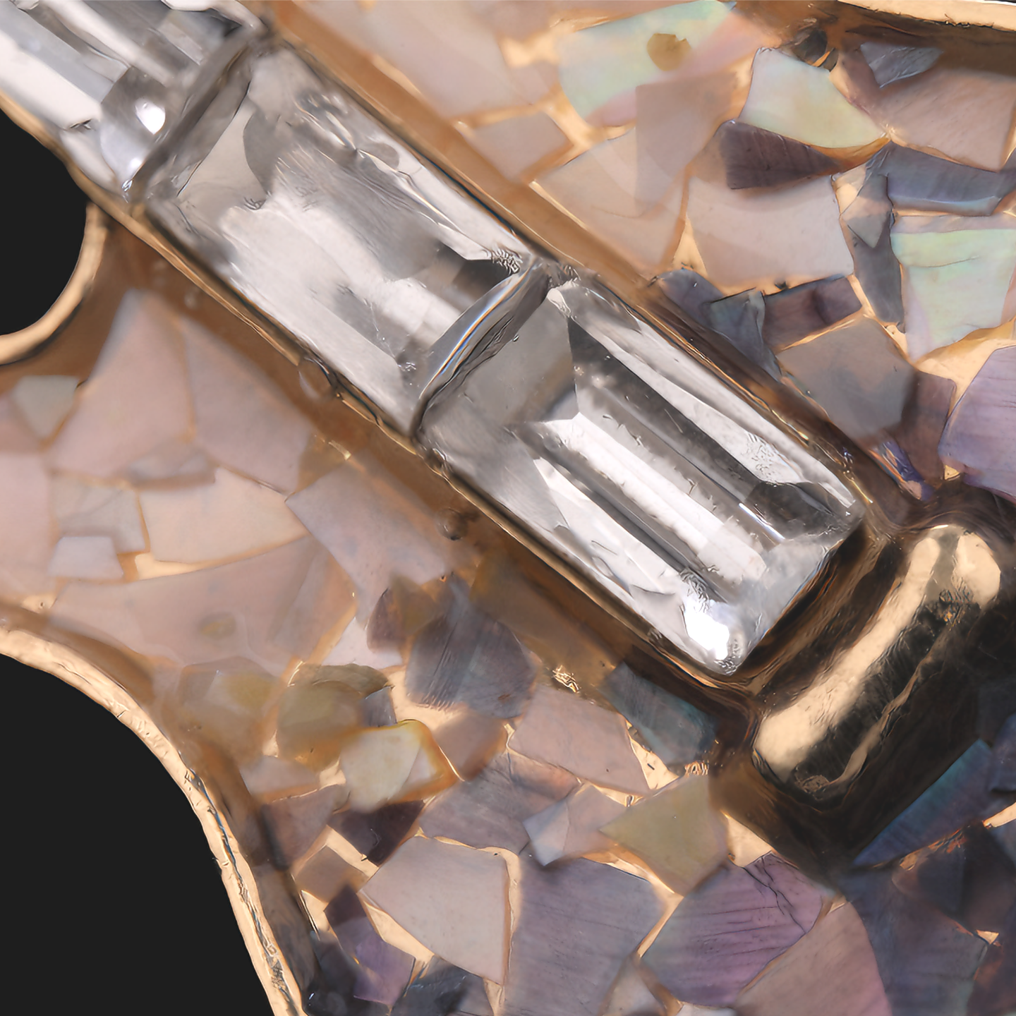 Close up of mother of pearl,nacre shell brooch＆guitar brooch on black