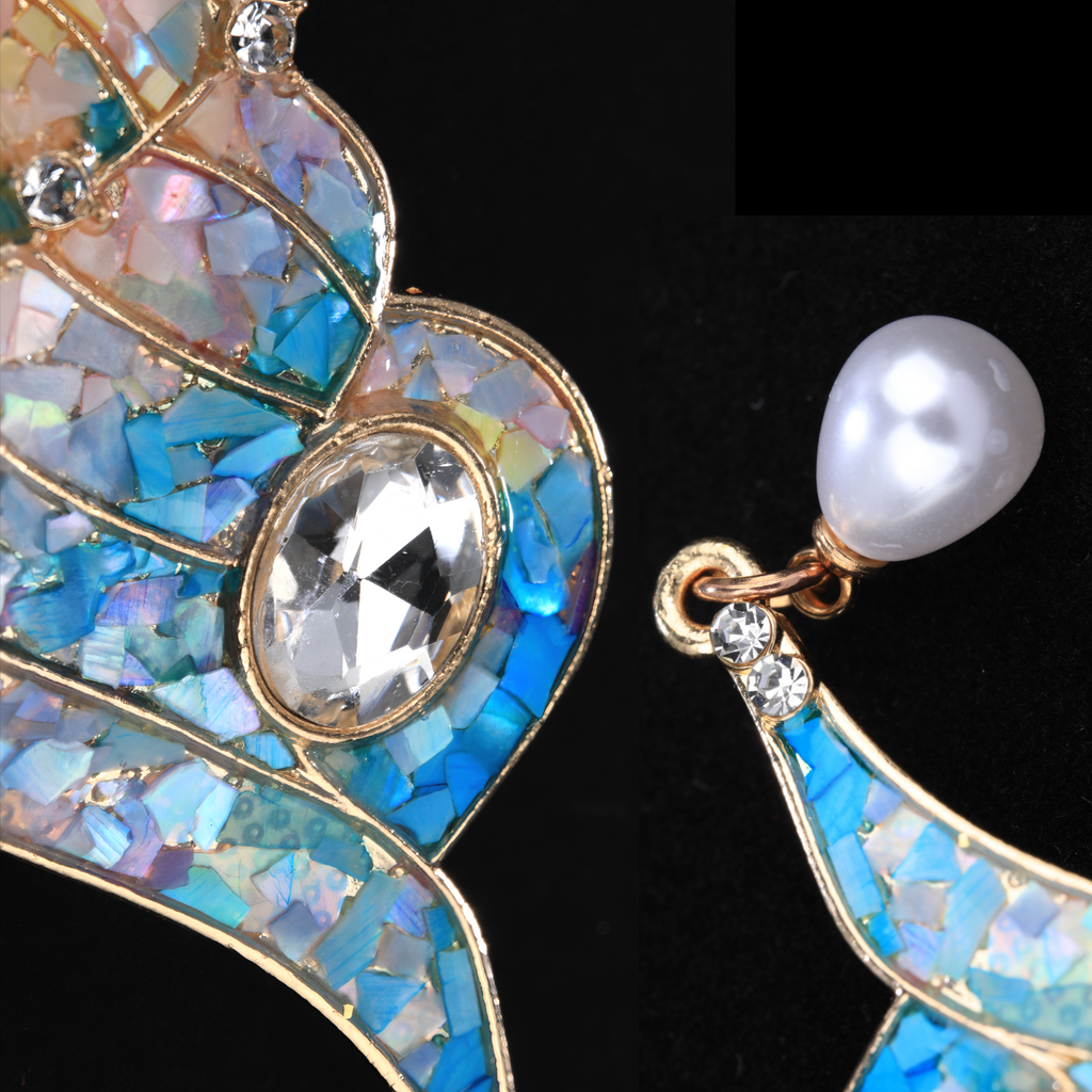 Close-up of Mother of Pearl Conch Brooch - Iridescent Shell Fragments and Sparkling Crystal Center