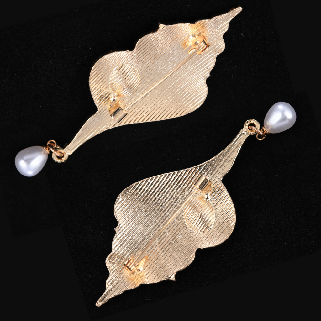 Close-up of Mother of Pearl Conch Brooch - Iridescent Shell Fragments and Sparkling Crystal Center