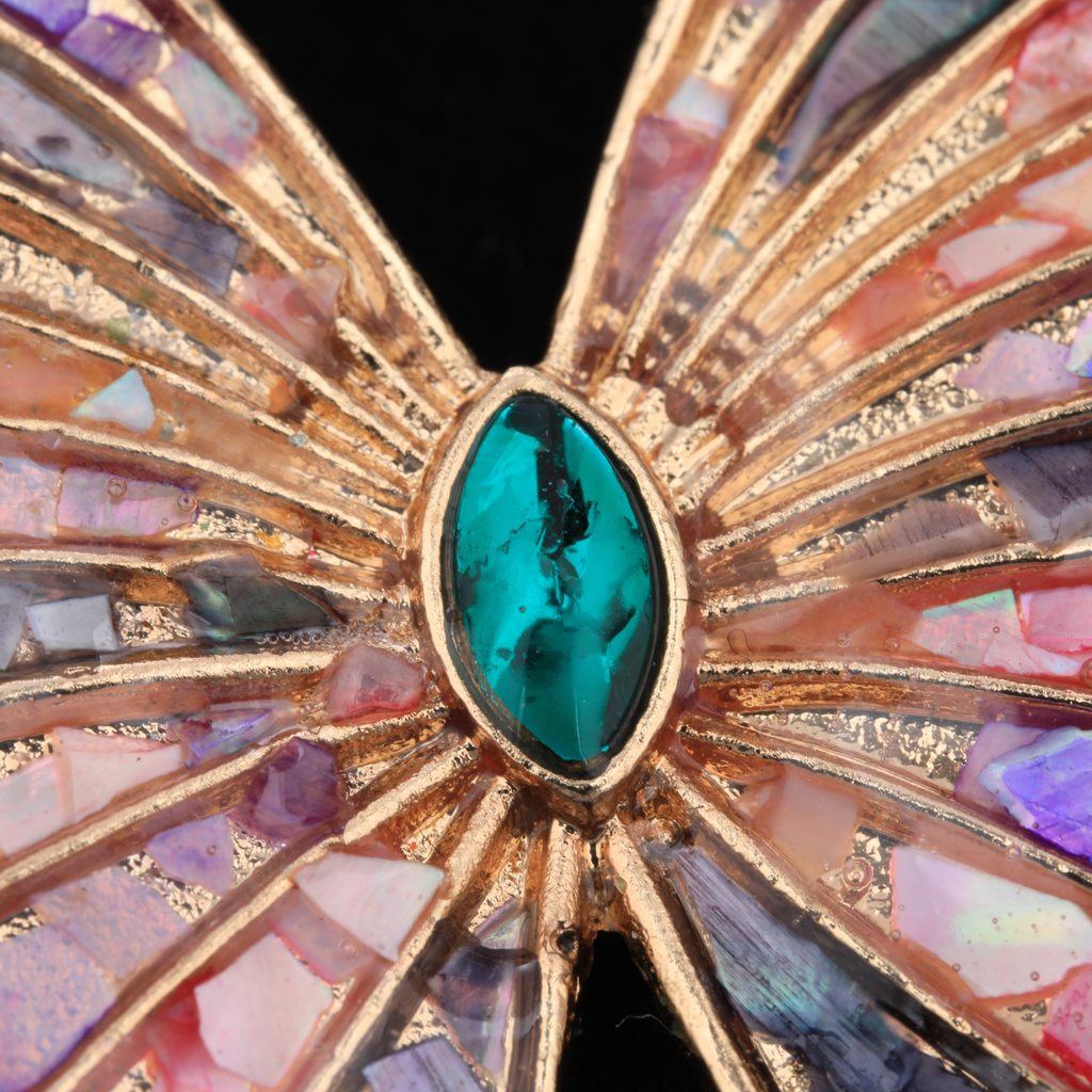Close up of mother of pearl,nacre shell brooch＆Butterfly brooch with pink-purple wings on black