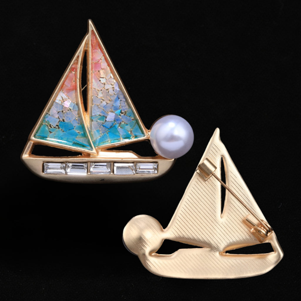 Front and back of mother of pearl,nacre shell brooch＆sailboat brooch on black