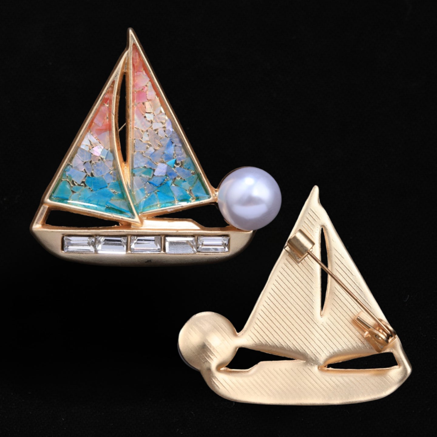 Front and back of mother of pearl,nacre shell brooch＆sailboat brooch on black