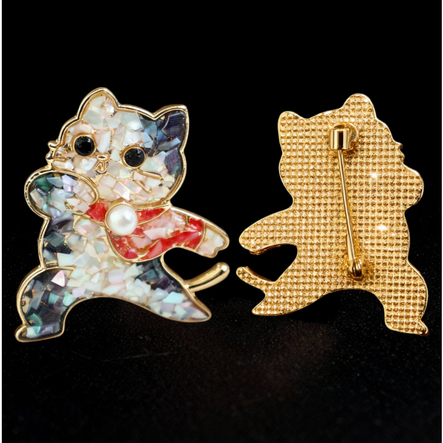 Front and back of Mother of Pearl Dancing Cat Brooch with Iridescent Shell Mosaic and Red Bow