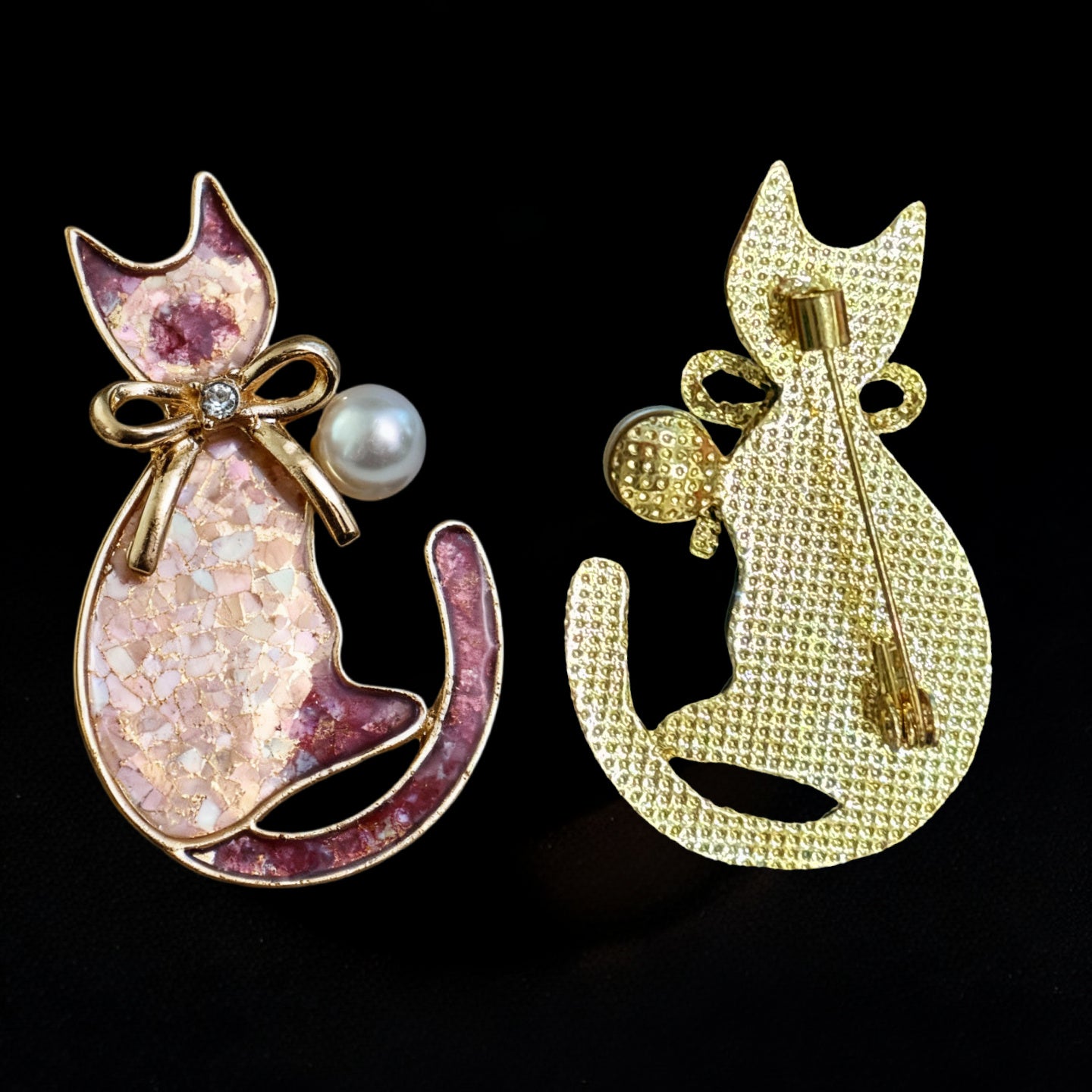 Artisan-made cat brooch with gold alloy base, diamond bow, and freshwater pearl accent