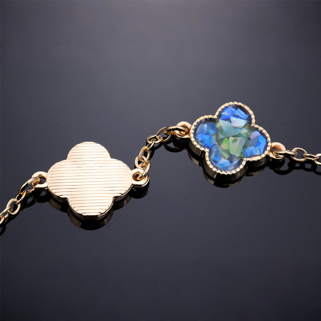 Artisanal mother-of-pearl fragment arrangement on clover base