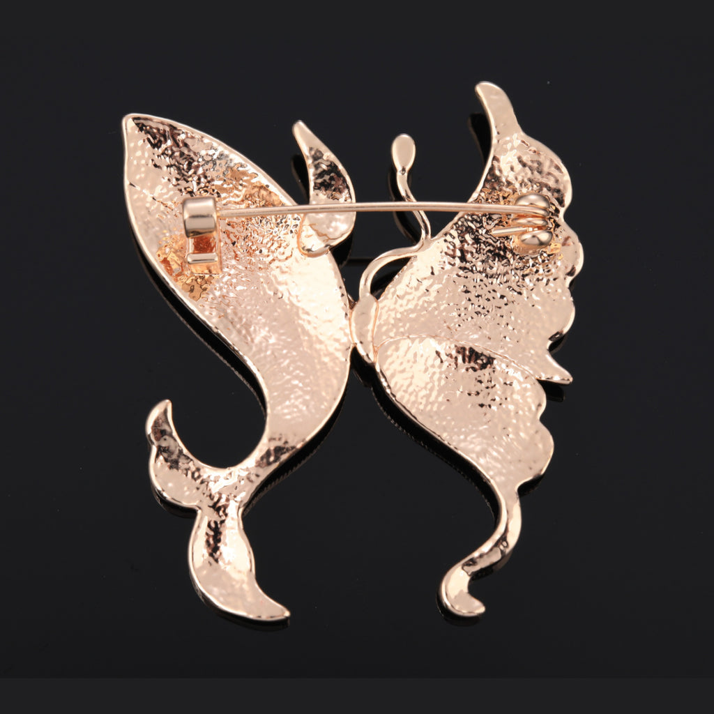 Back of butterfly mother of pearl brooch with pin clasp