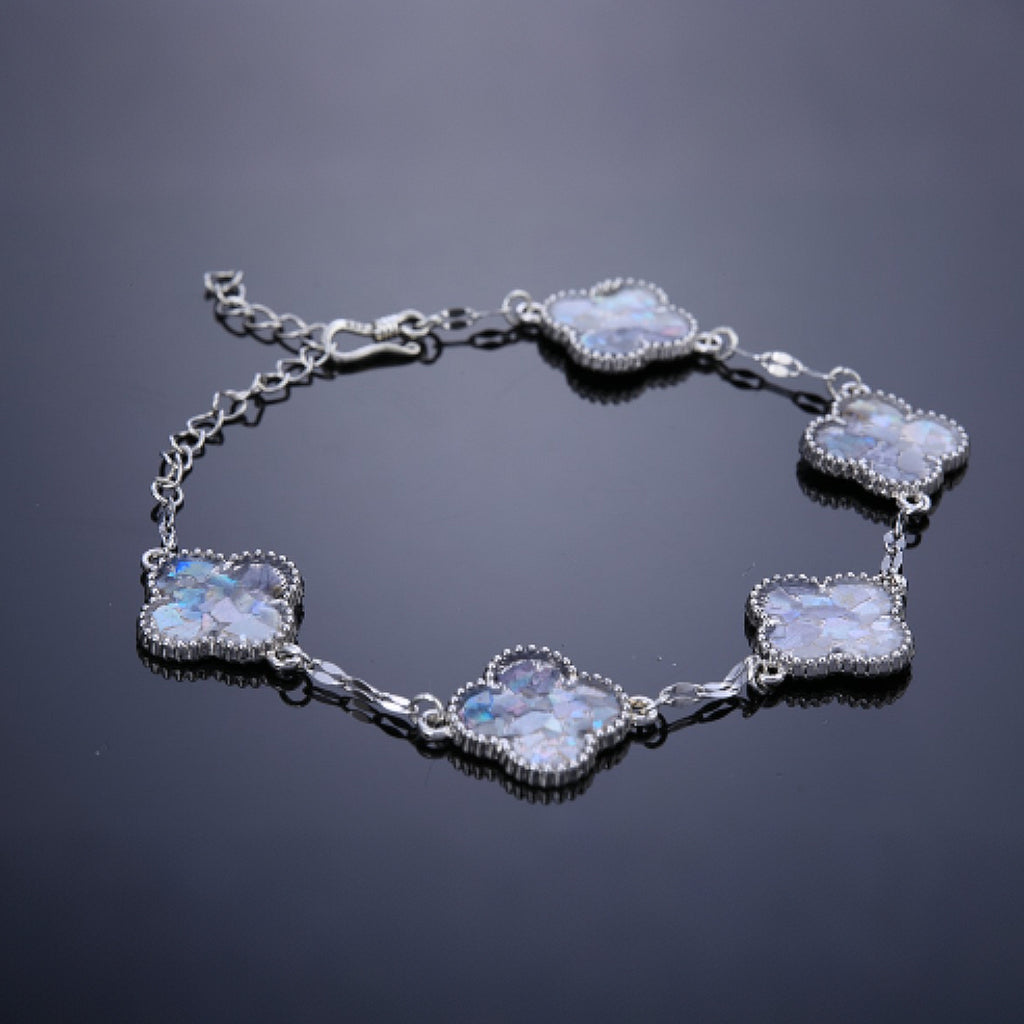 Close-up of clover inlay showing shimmery mother of pearl texture