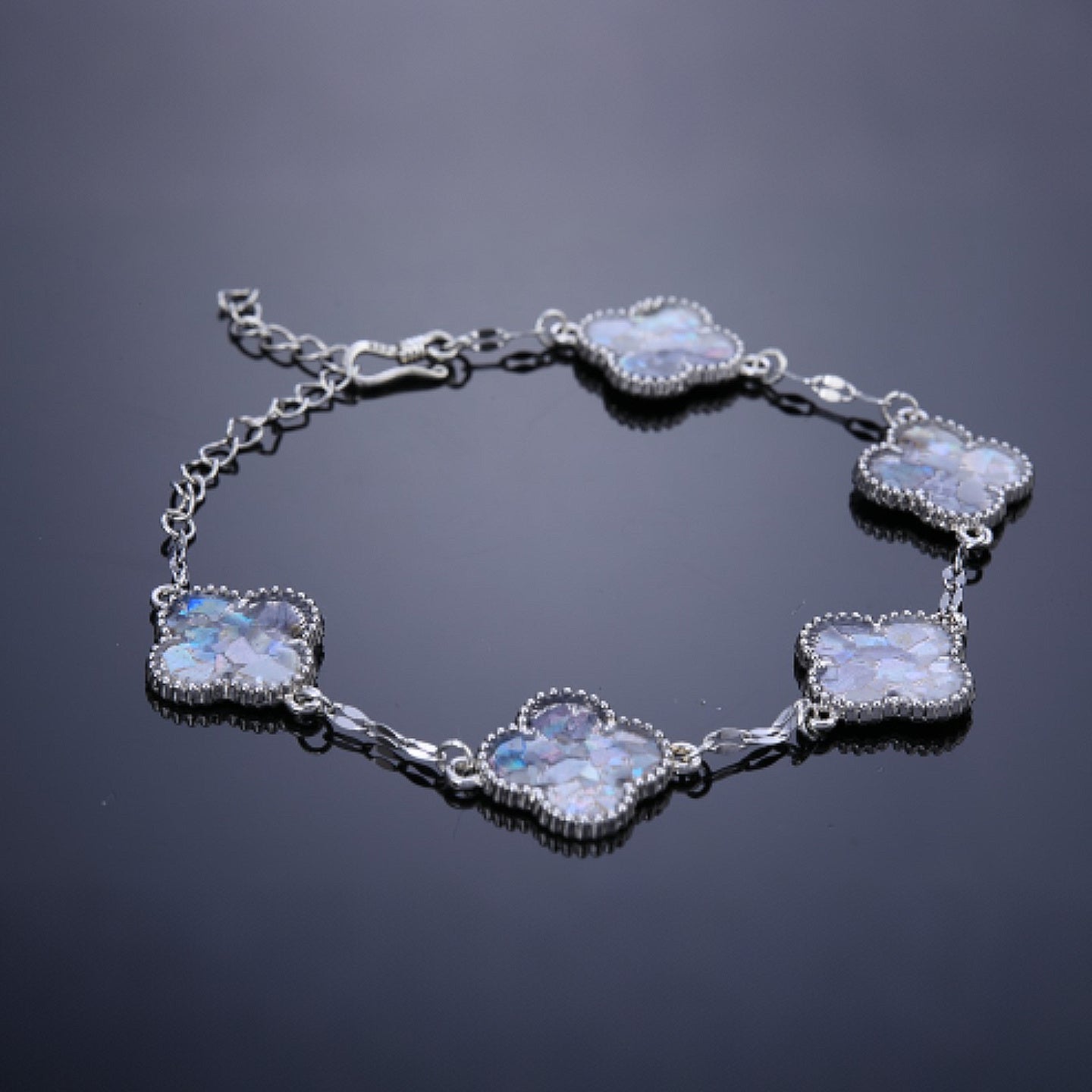 Close-up of clover inlay showing shimmery mother of pearl texture