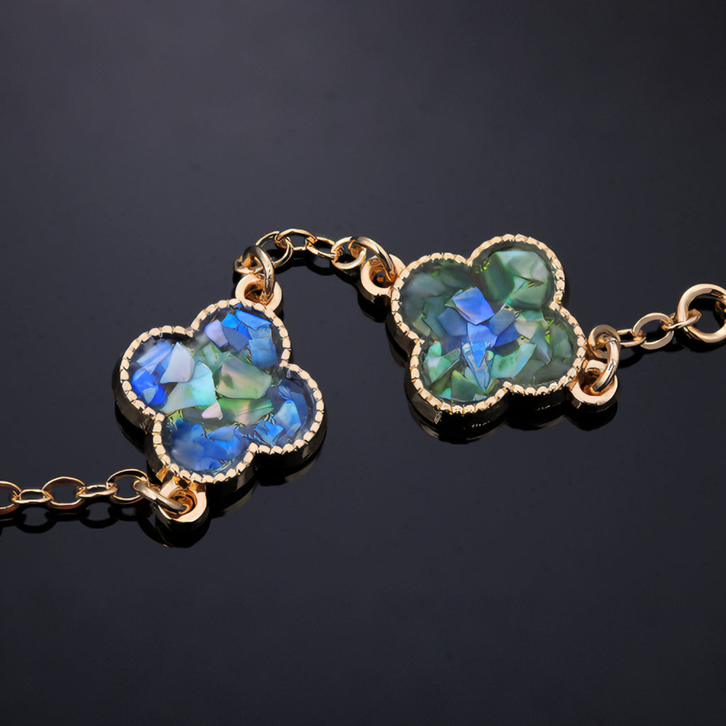 Worn iridescent clover bracelet (everyday luxury accessory)  