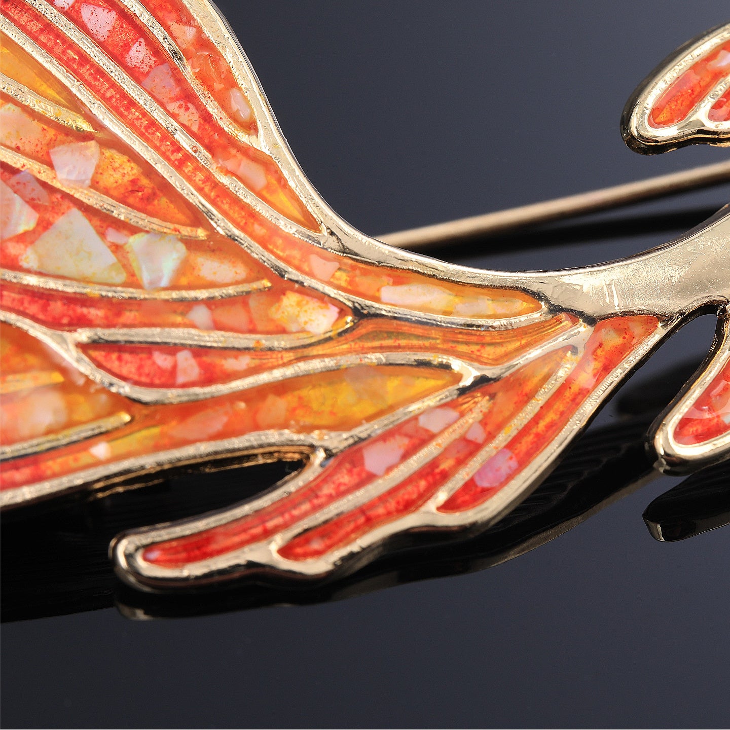 Close-up of hand-inlaid mother of pearl fragments on koi brooch
