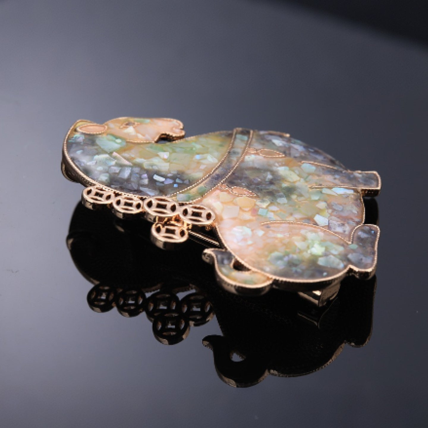 Close-up of mother of pearl,nacre shell brooch＆Lucky Horse brooch