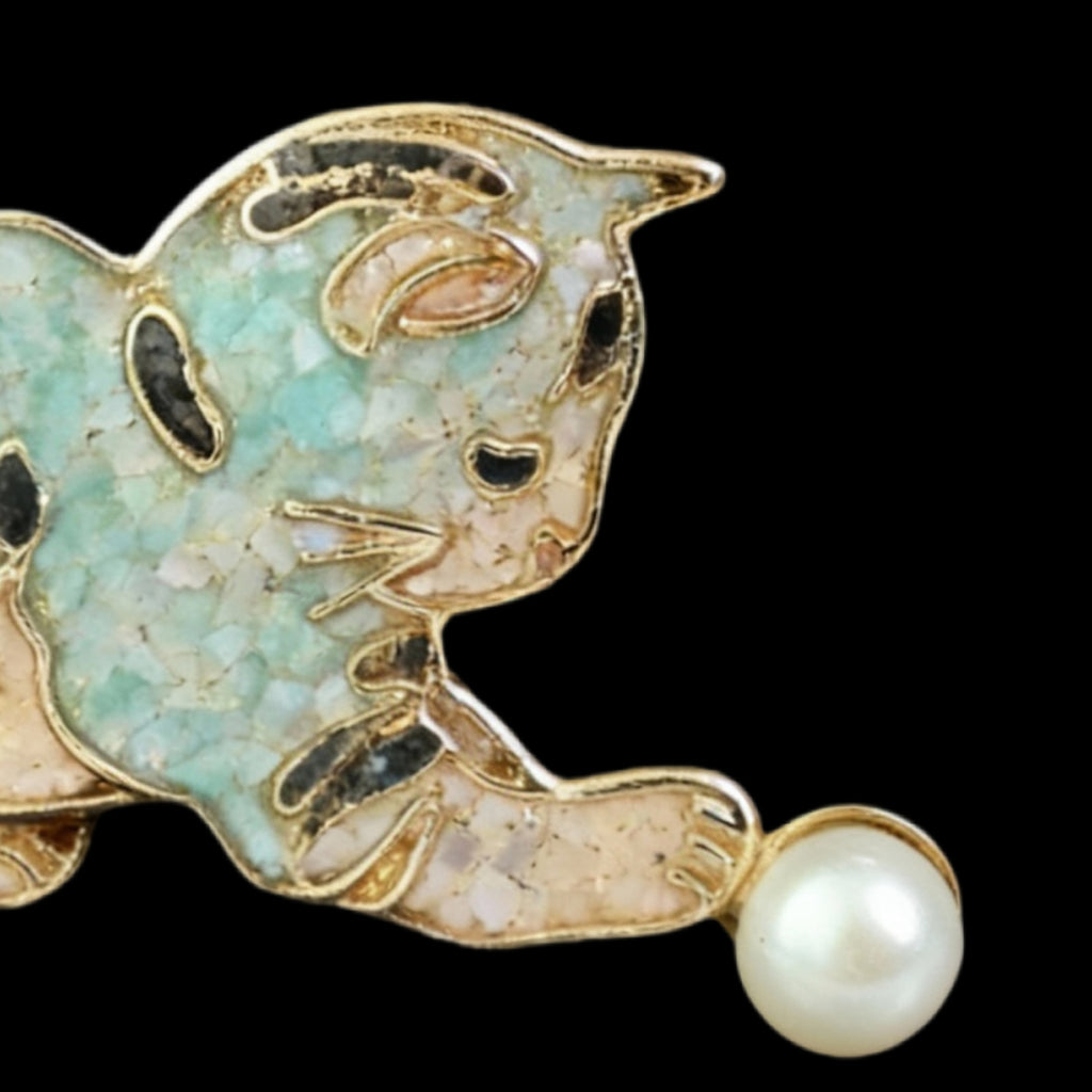 Close up of Mother of Pearl Cat Brooch, nacre shell brooch with blue tone
