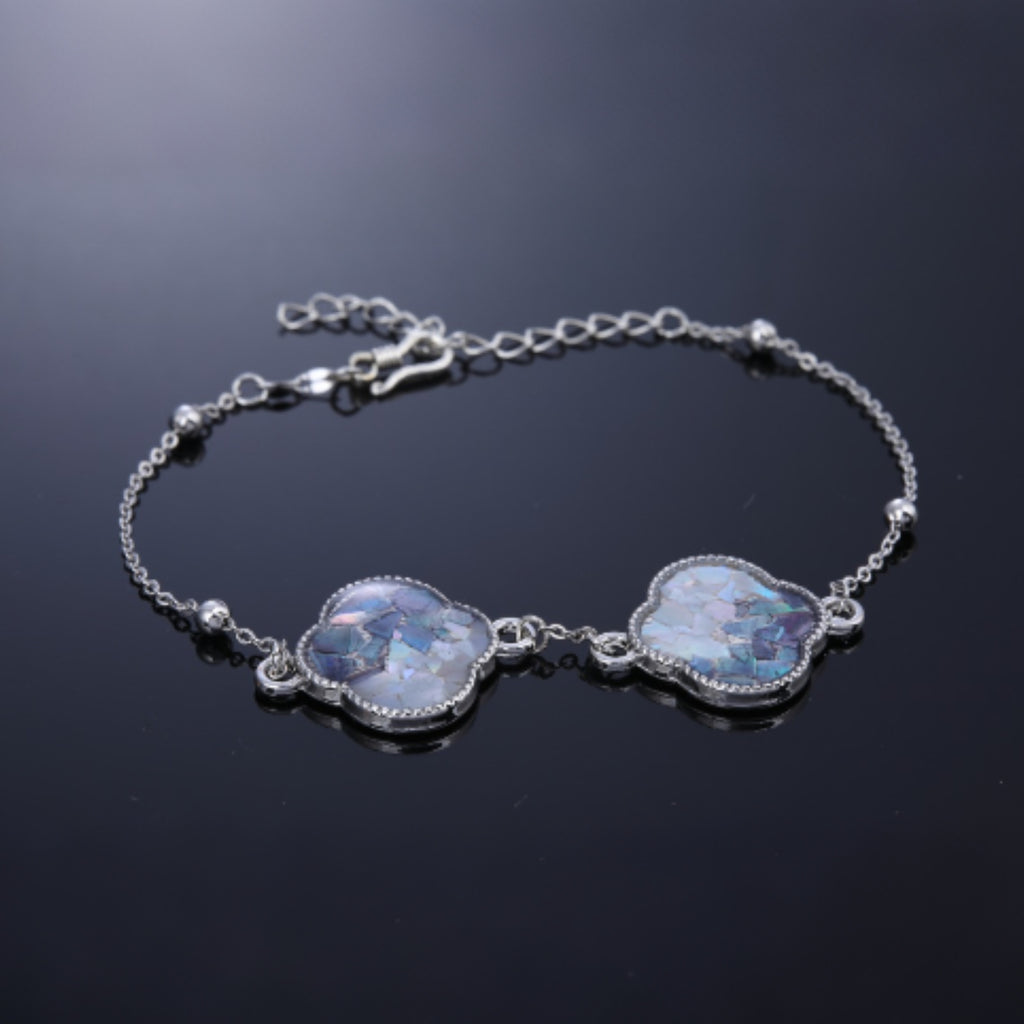  Close up of shell fragment mosaic on mother of pearl bracelet