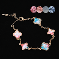 Handcrafted mother of pearl clover bracelet with gradient shell inlays on gold chain