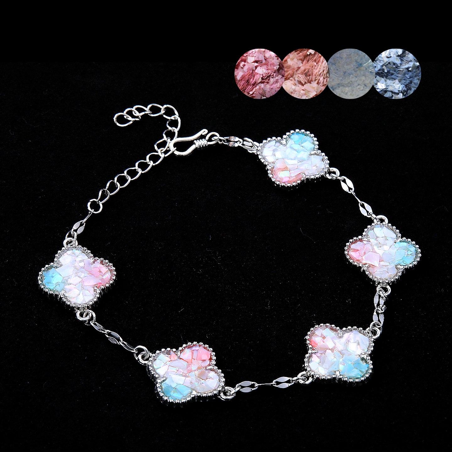 Clover mother of pearl bracelet with pink-blue gradient charms on display  