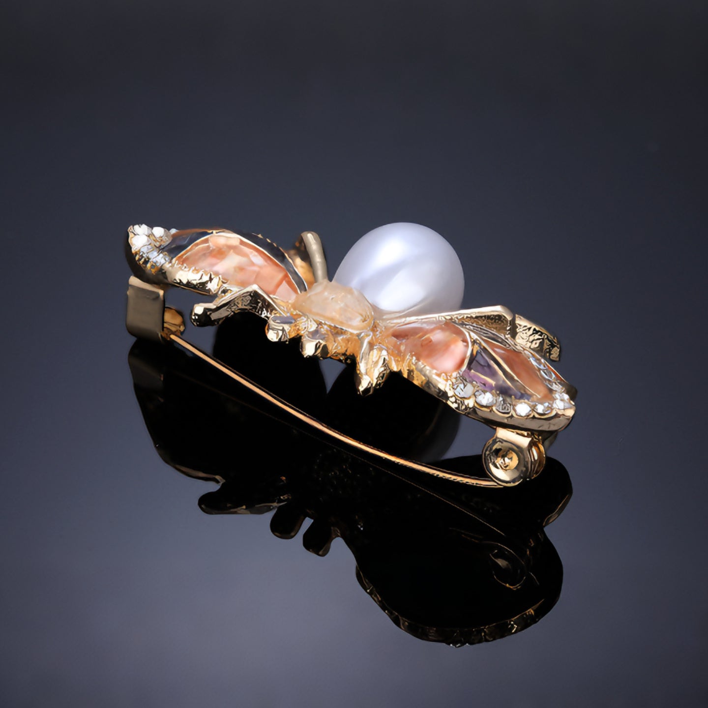Close-up of iridescent mother of pearl inlay on bee brooch wings