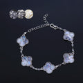  Main Image: Clover mother of pearl bracelet with iridescent accents on black background  