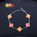  Clover mother of pearl bracelet with warm gradient charms on display  
